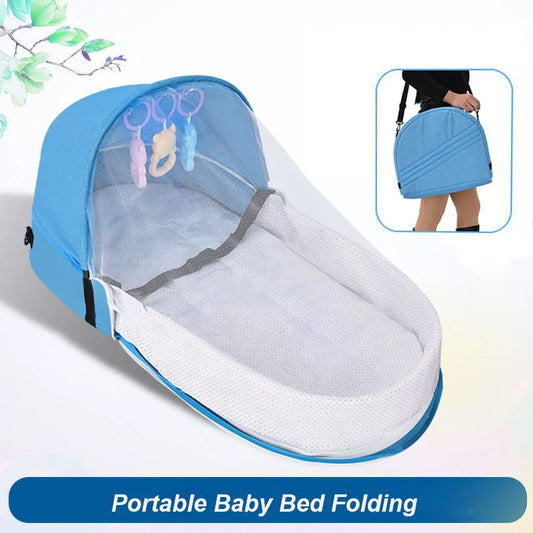 Portable baby bed with canopy and inset of person holding it, on a light gray background.