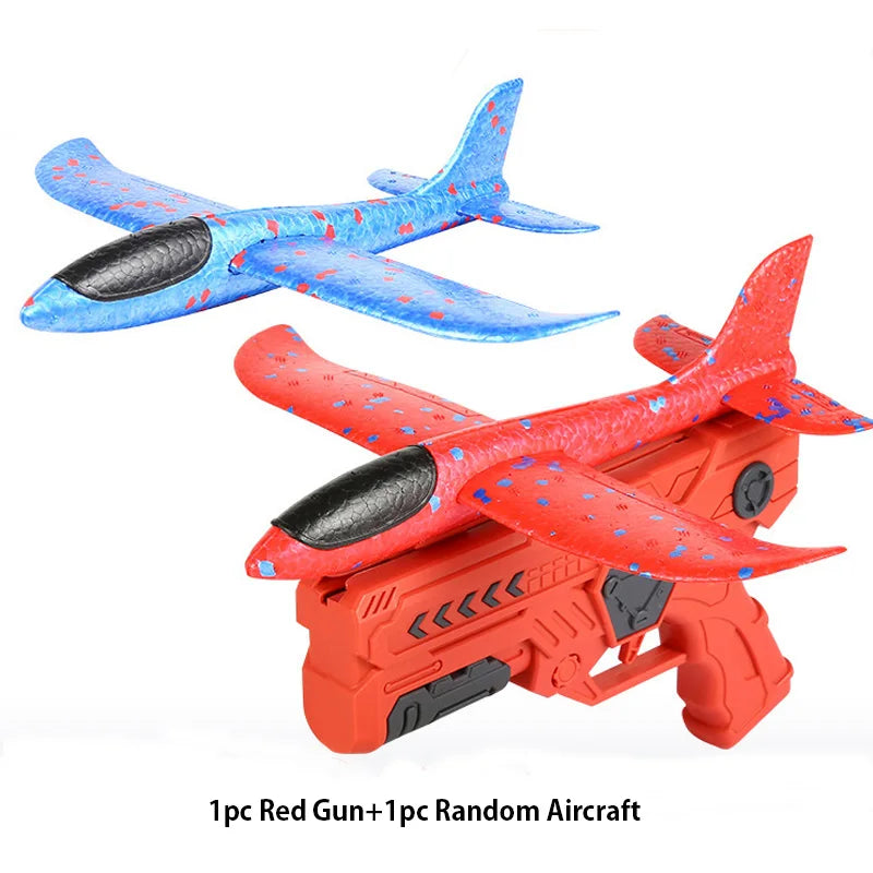 Red toy gun with a blue and red airplane.