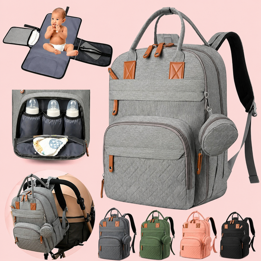 Gray diaper bag with multiple compartments and accessories on a pink background