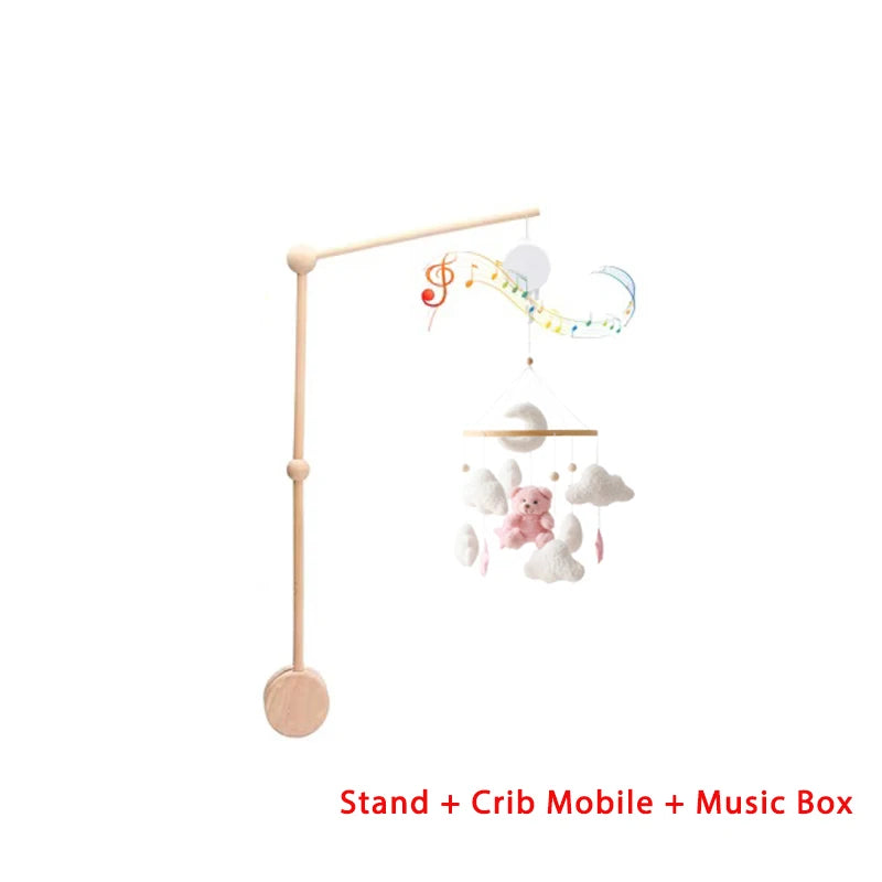 Baby crib mobile with stand, pink bear, clouds, white moon and music box on a white background