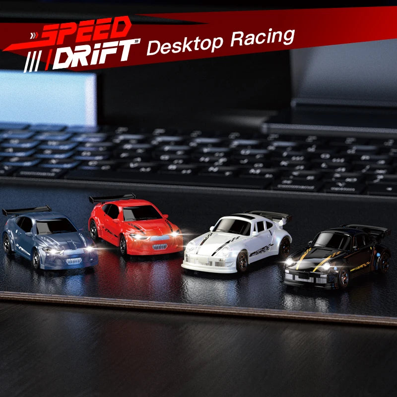 Four toy cars on a desk with 'Speed Drift Desktop Racing' branding.