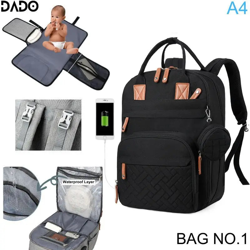 Black backpack with baby changing pad and multiple compartments on a white background