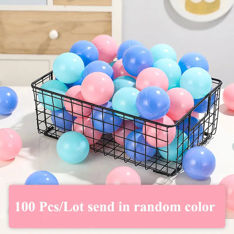 Basket filled with colorful plastic balls on a light surface.