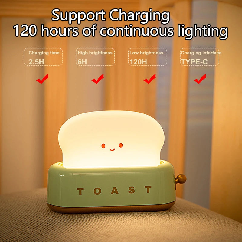 Lighting device shaped like a toaster with glowing face, labeled 'TOAST', on a neutral background.