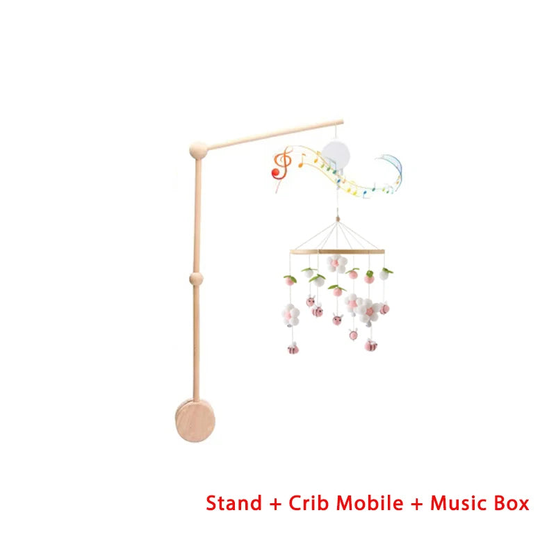 Baby crib mobile with stand and music box on a white background