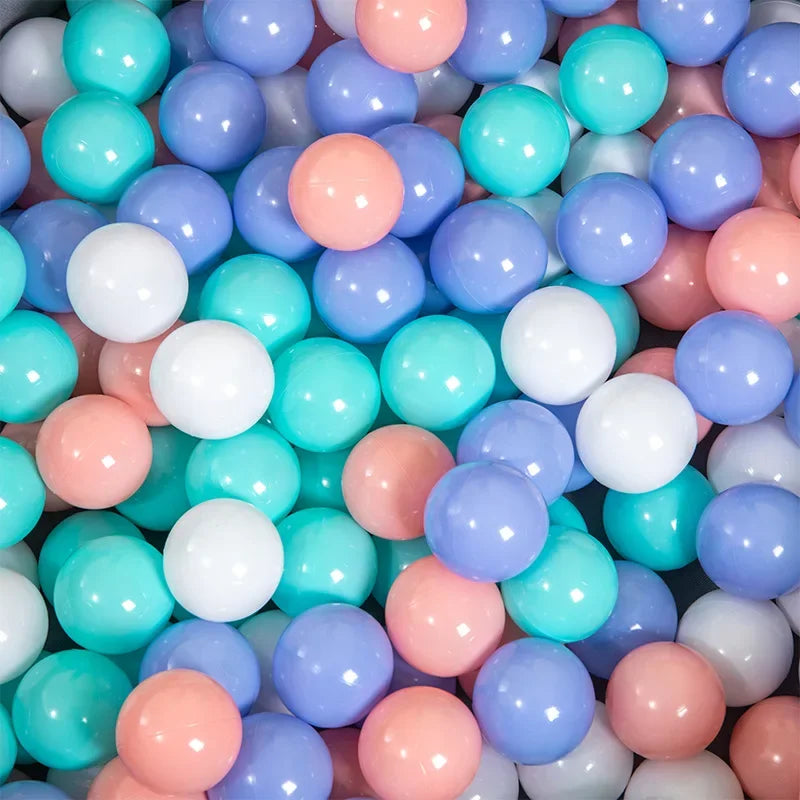 Close-up of colorful plastic balls in various pastel shades.
