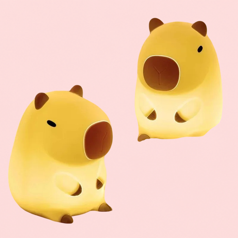 Two yellow cartoon-style Cute Capybara lamps shaped like animals on a pink background