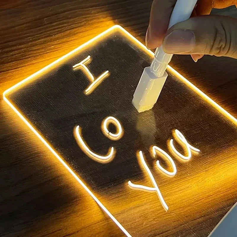 Neon sign with 'I love you' text being applied to a wooden surface.