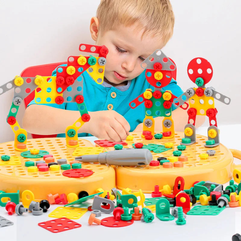Child playing with colorful diy engineering building blocks set on a white table