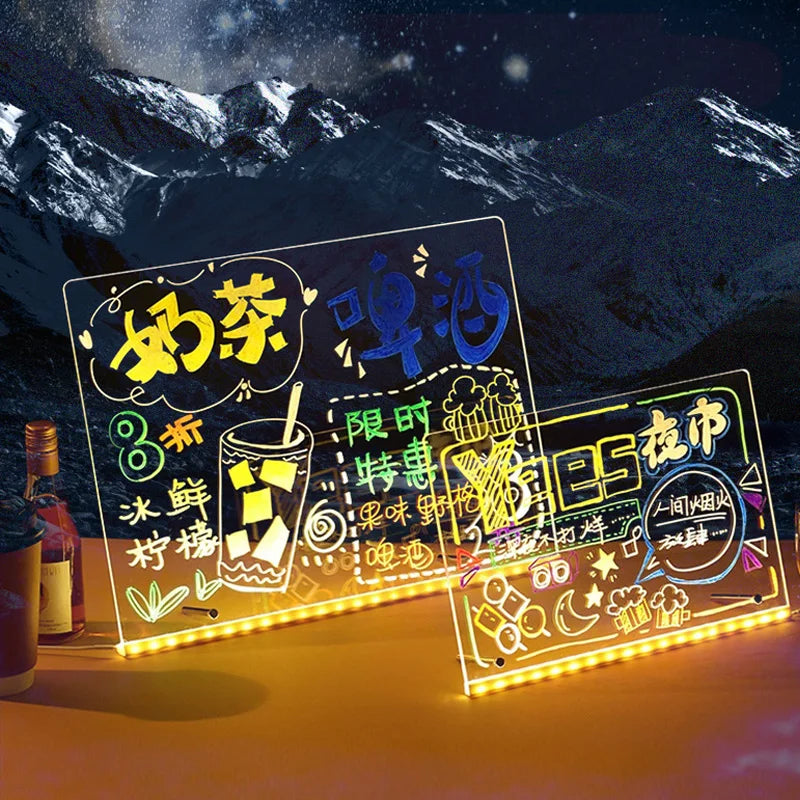 LED sign with colorful text and graphics on a mountainous background