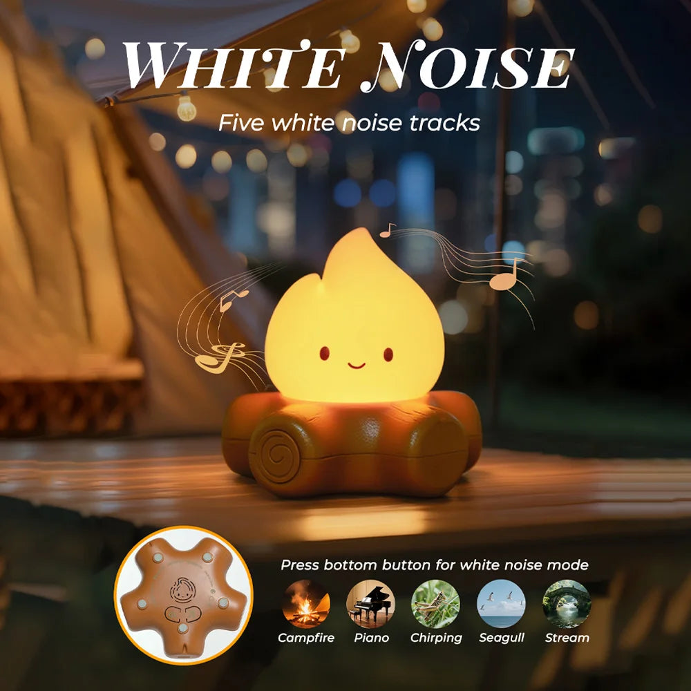 White noise machine with flame design on a wooden surface at night.