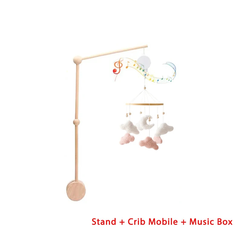Baby crib mobile with stand and music box on a white background