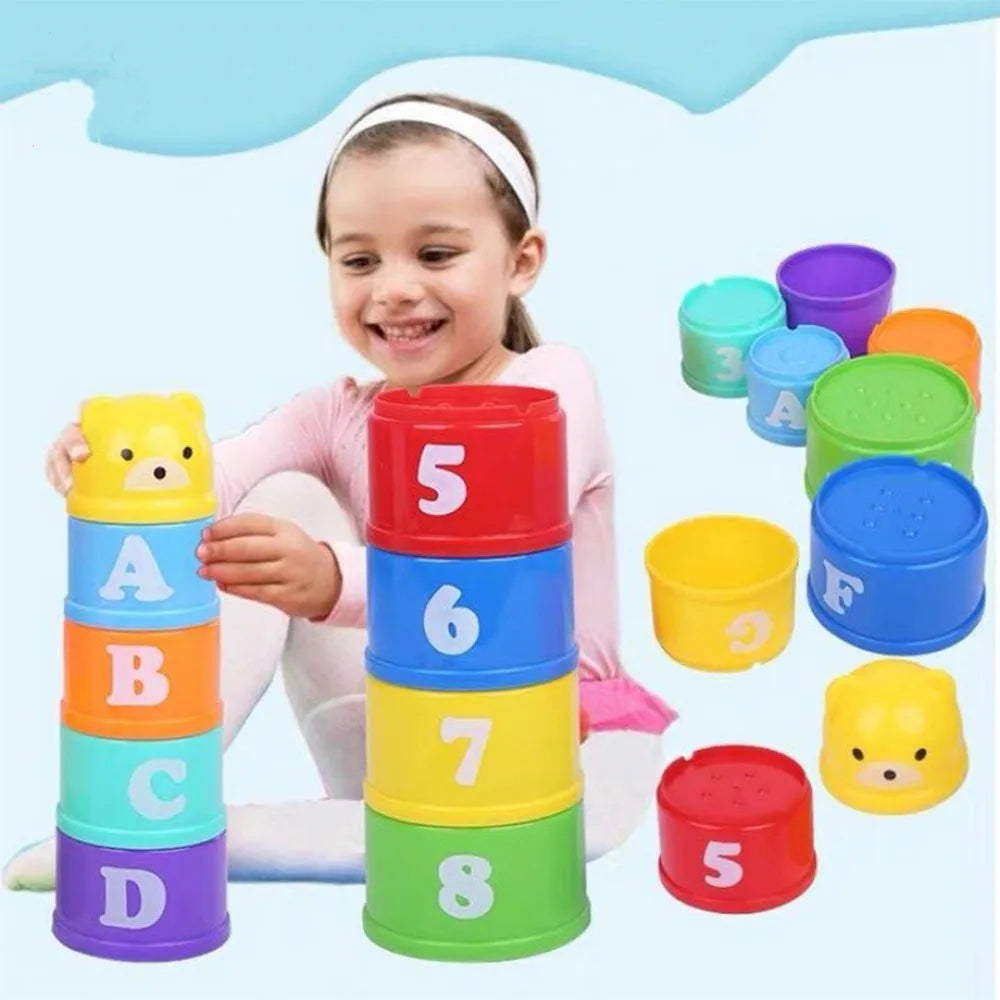 Child playing with colorful stacking cups with numbers and letters on a light blue background