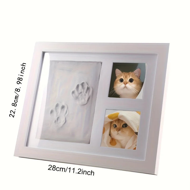 White photo frame with pet prints and images on a white background