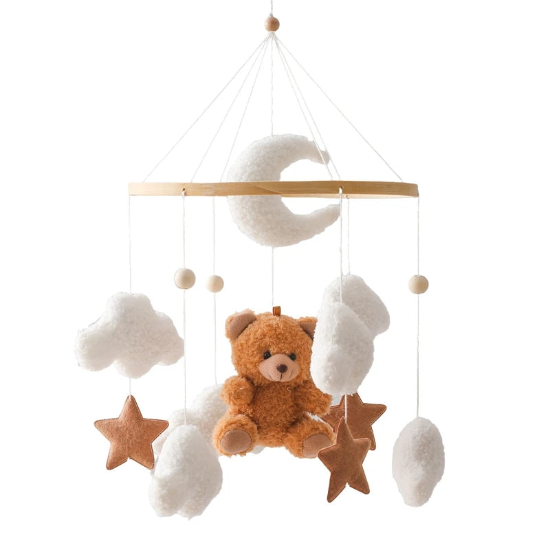 Baby crib mobile with teddy bear, stars, and clouds on a white background