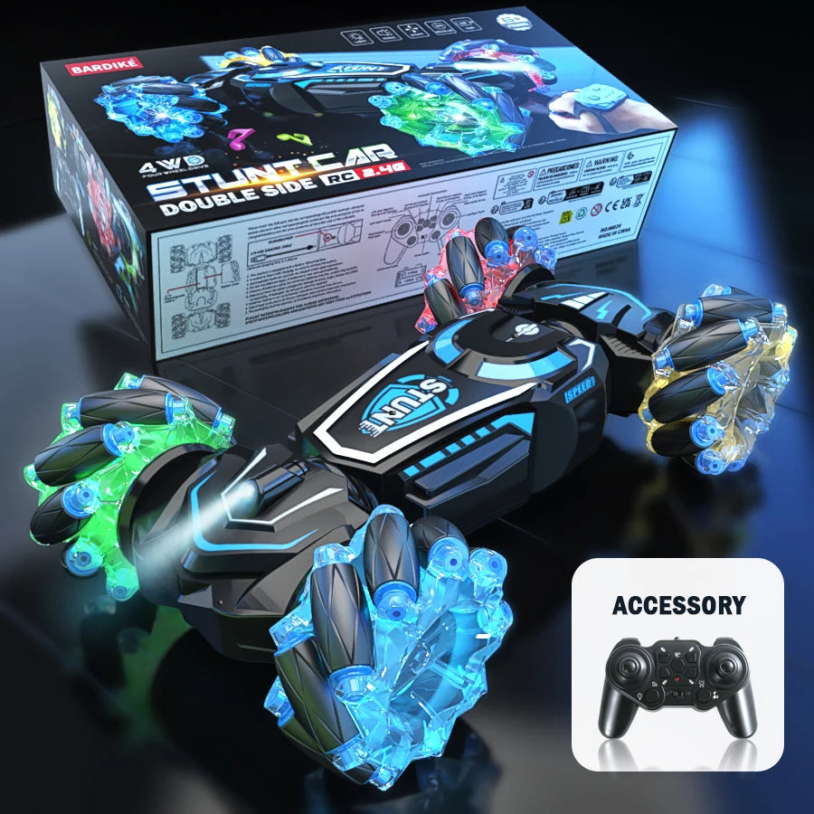 Toy car with LED lights and remote control accessory on a dark surface
