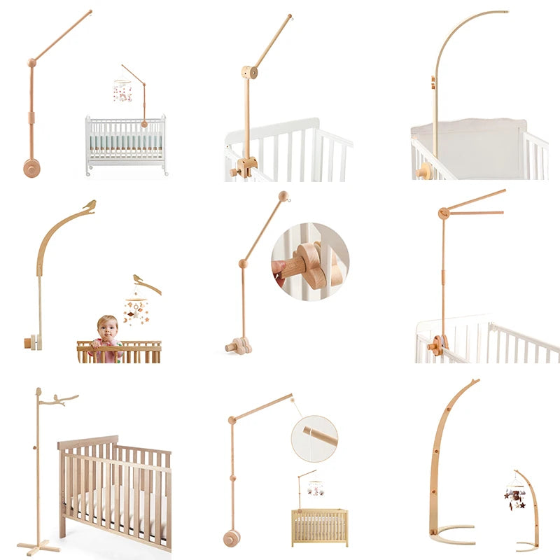 baby crib with a wooden stand and hanging mobiles on a white background