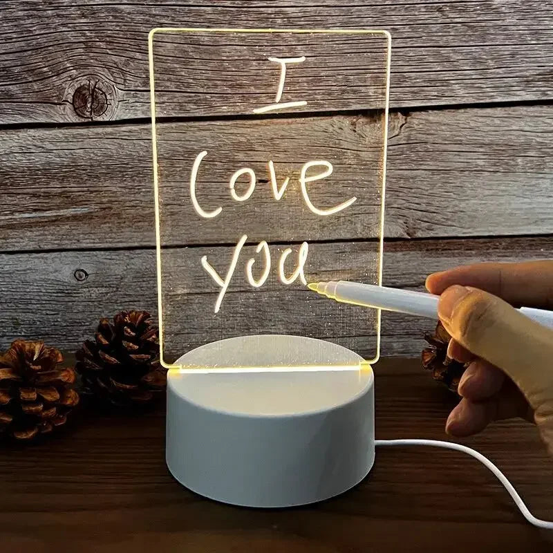LED writing board with 'I Love You' text on a wooden surface