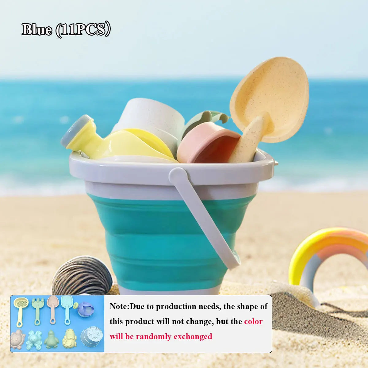 Collapsible sand bucket with beach toys on a sandy beach with ocean in the background