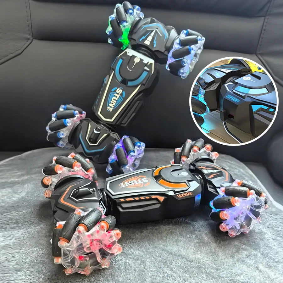 Pair of glowing gloves with colorful LED lights on a gray surface.