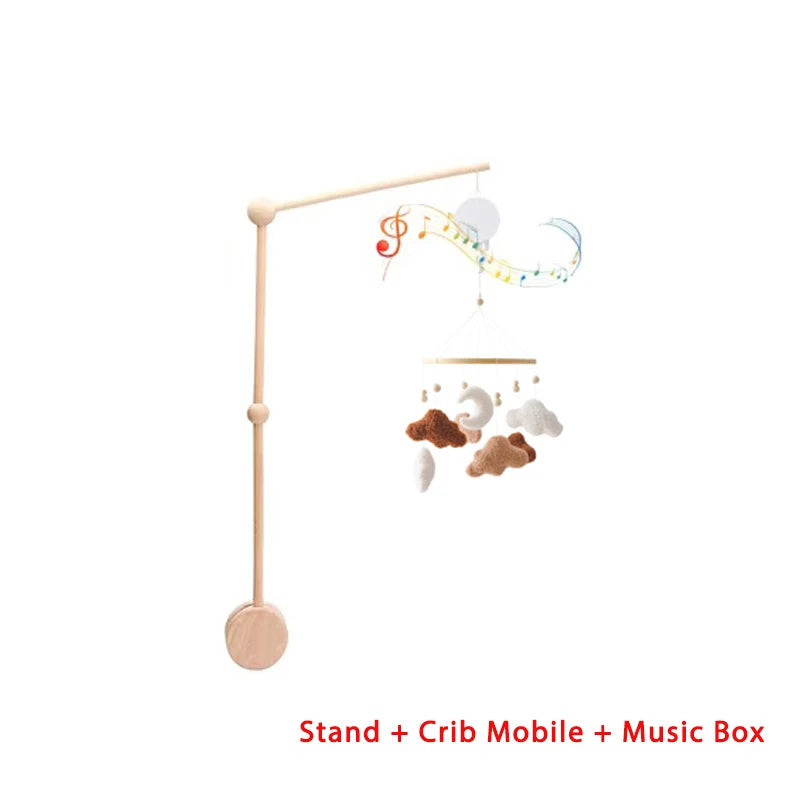 Baby crib mobile with stand and music box on a white background