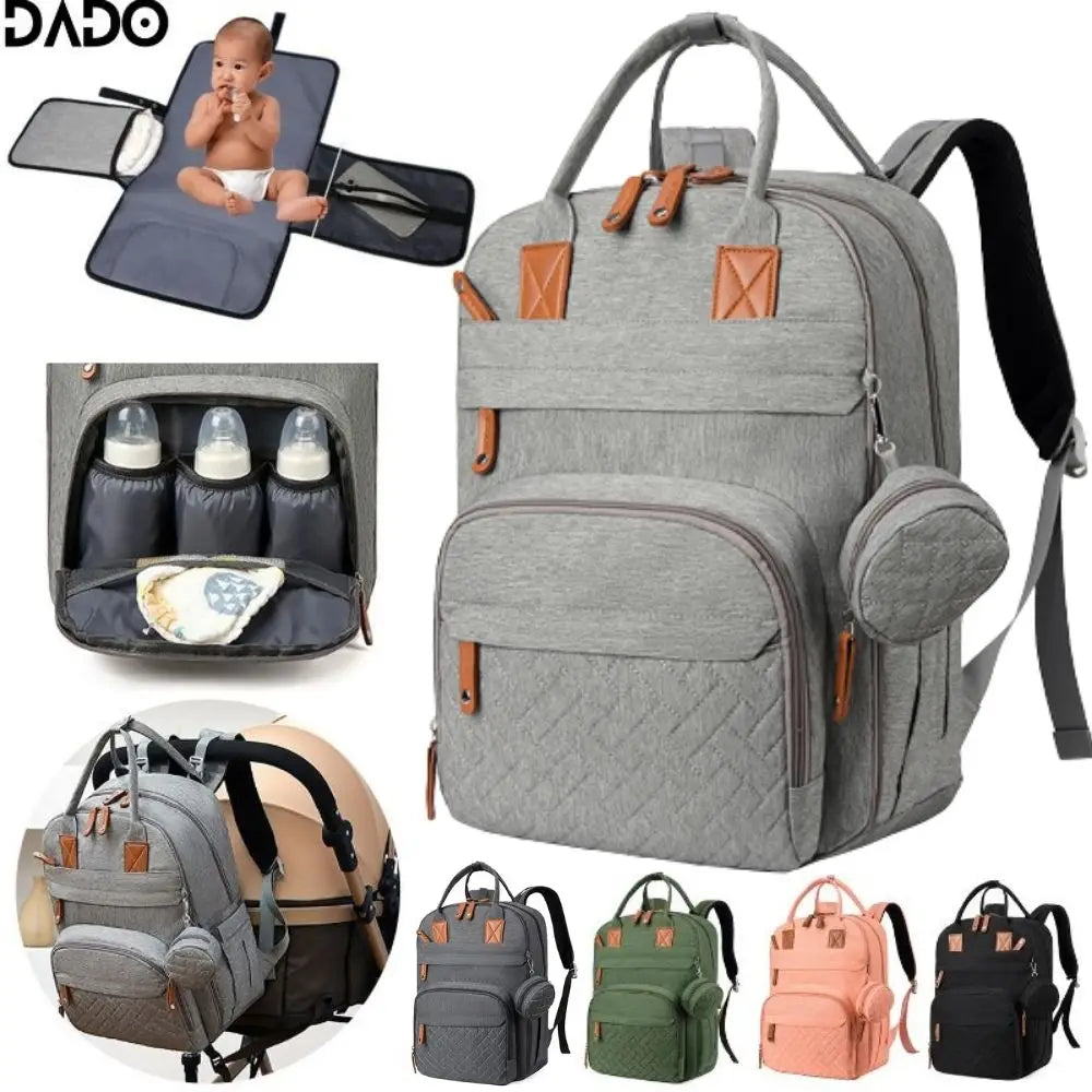 Gray diaper bag with multiple compartments and accessories on a white background