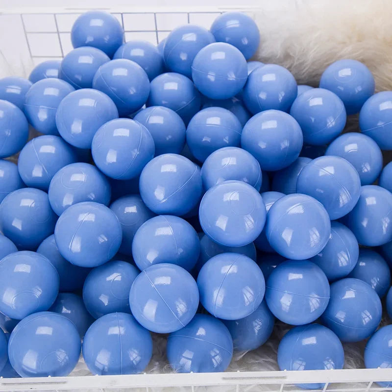 Basket filled with blue plastic balls on a white tiled floor