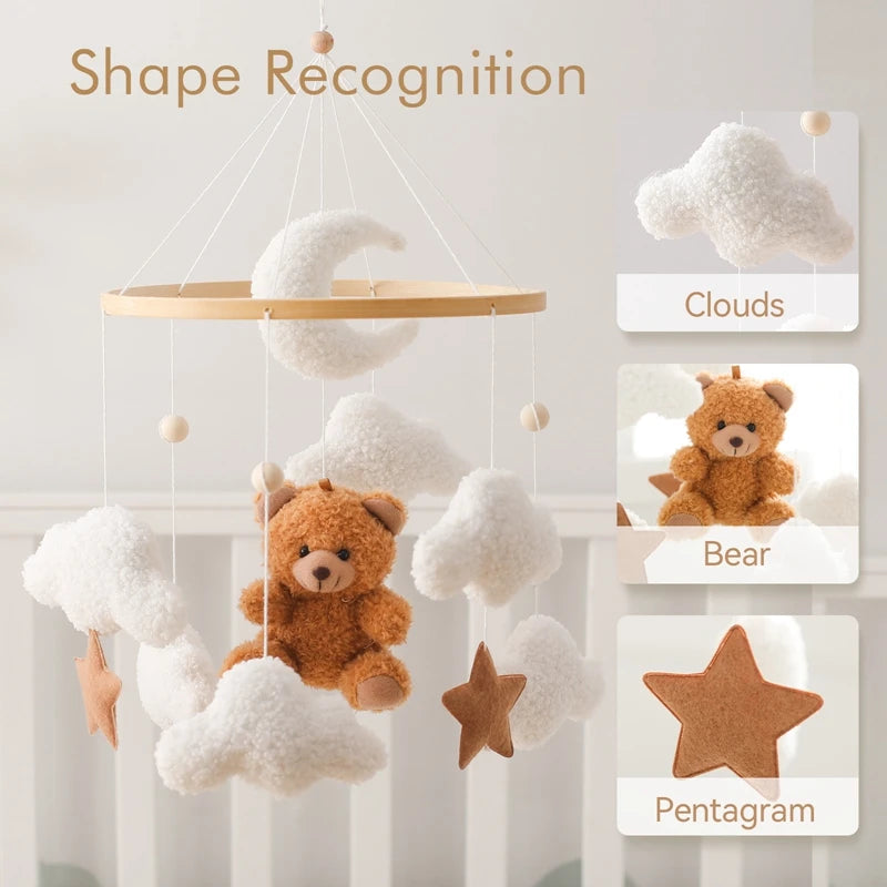 Baby mobile with teddy bear, clouds, and pentagram on a light background