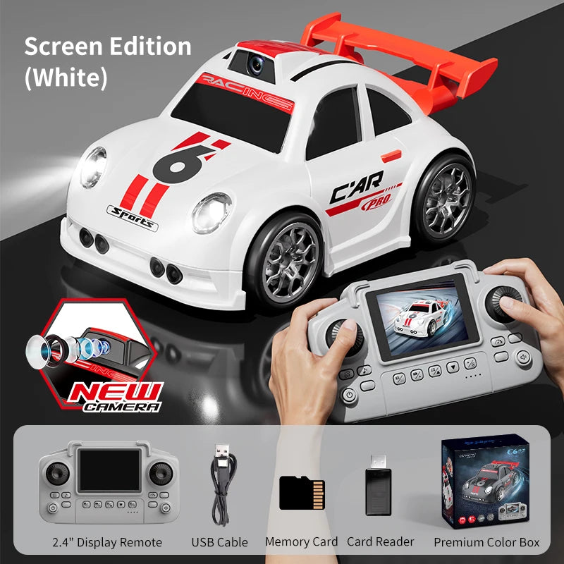 White toy car with a camera and red accents and a screen edition remote control.