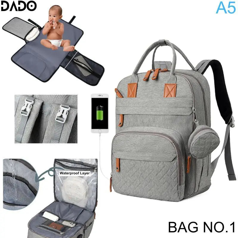 Gray diaper bag with multiple compartments and features, including a baby seat and waterproof layer, on a white background.