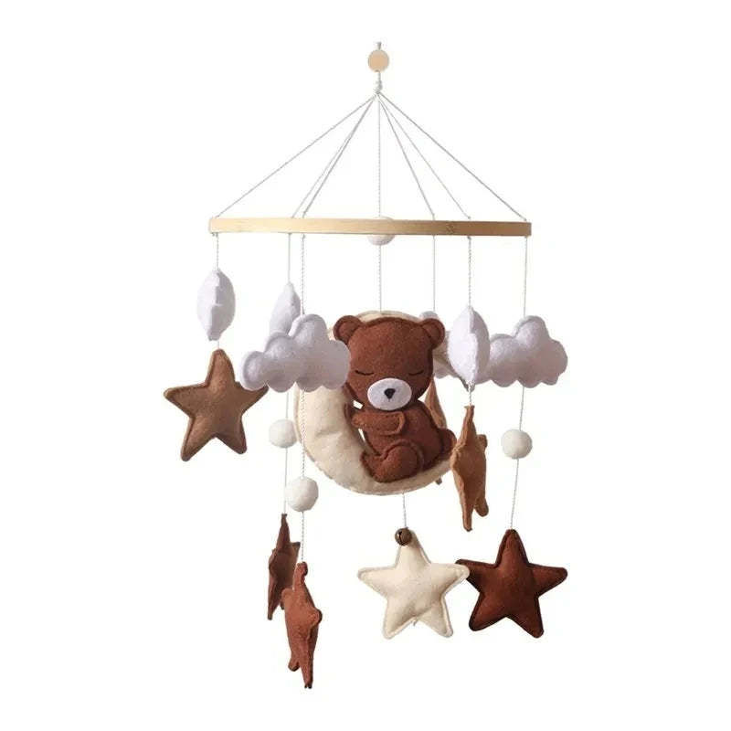 Baby felt crib mobile with teddy bear and stars on a white background