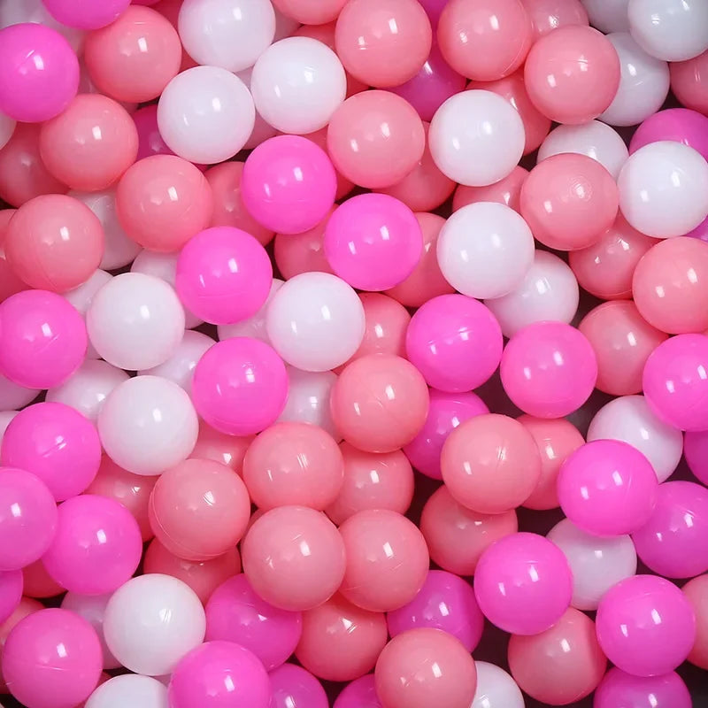 Close-up of pink and white plastic balls