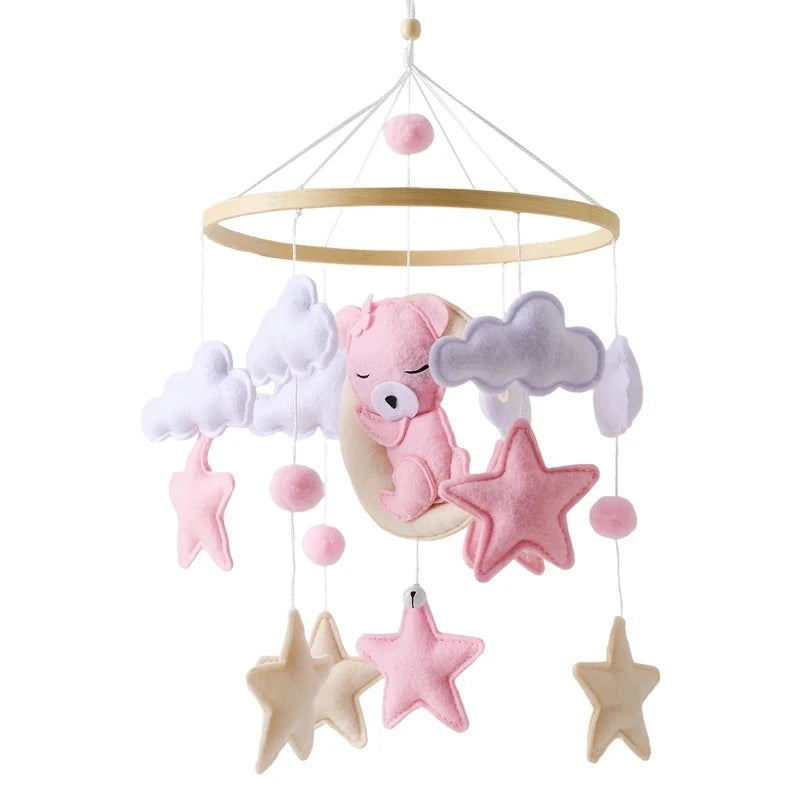 Felt Baby crib mobile with pink bear, stars, and clouds.