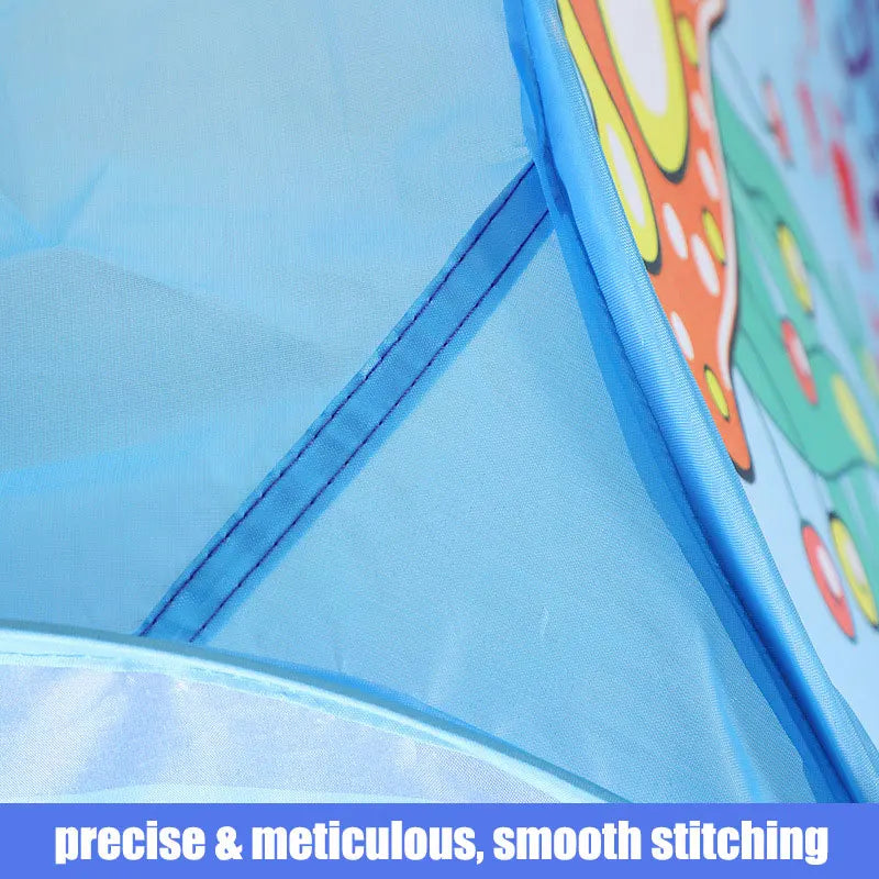 Close-up of a blue fabric with smooth stitching, featuring a colorful circular object in the corner.