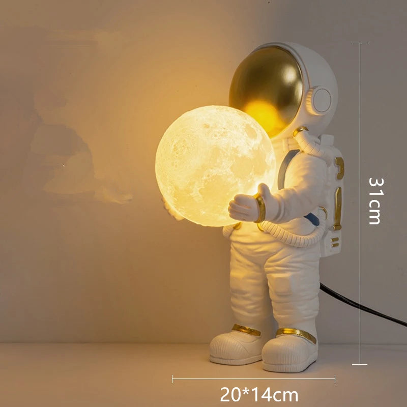 Decorative lamp shaped like an astronaut holding a moon, with dimensions indicated.