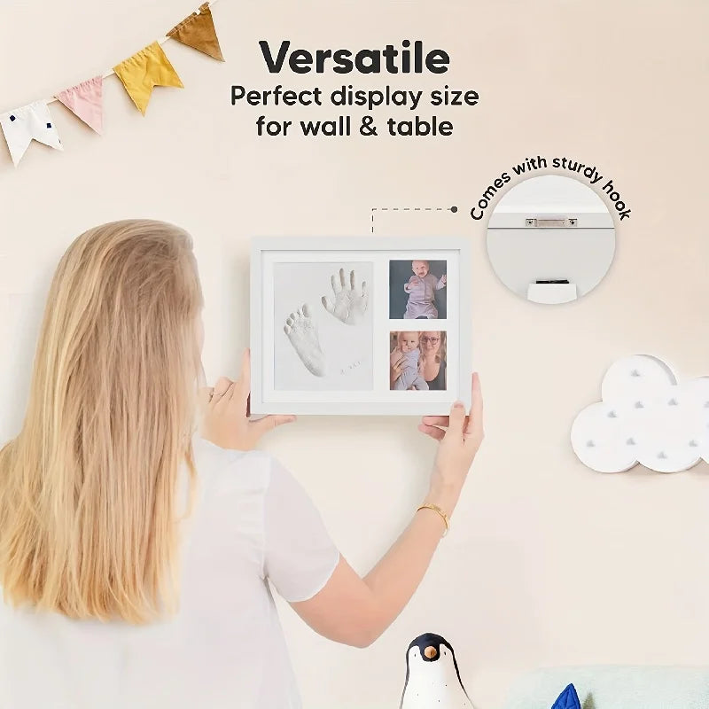 Person holding a framed display with handprints and photos, with text about versatile display size for wall and table.