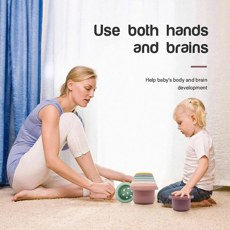 Woman and child playing with colorful containers on the floor, with text about using both hands and brains for baby development.