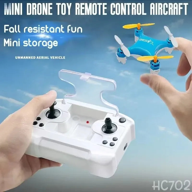 Mini drone toy remote control aircraft with a person holding the controller against a blue sky background.