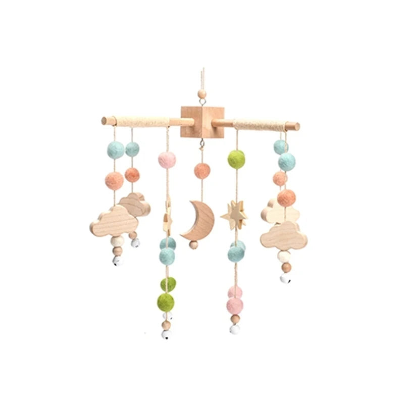 Wooden and felt baby crib mobile with colorful beads and shapes.