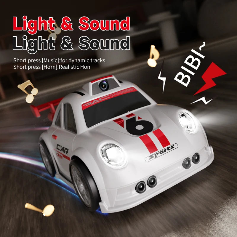 Toy car with light and sound features on a wooden floor