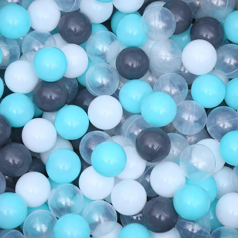 Colorful ball pit balls in blue, gray, Transparent and white.