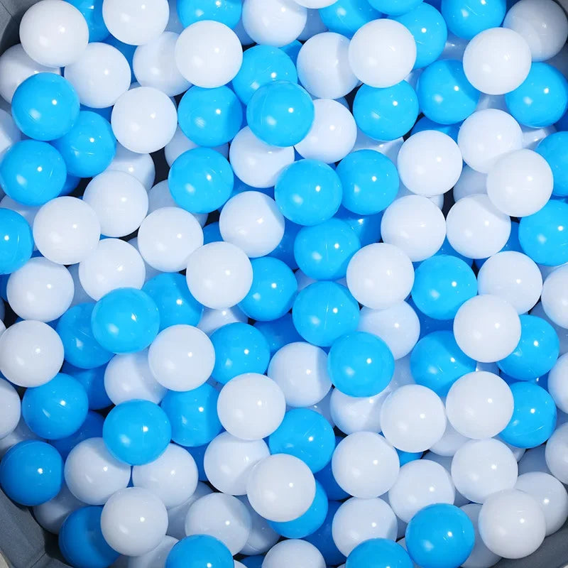 Close-up of blue and white balls in a container