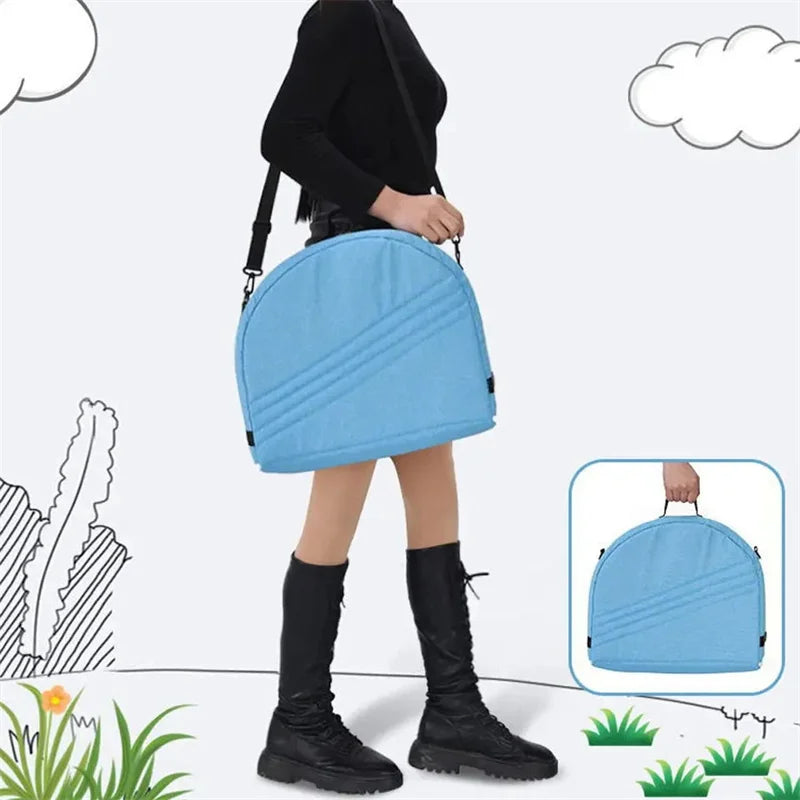 Person holding a blue suitcase with a white background