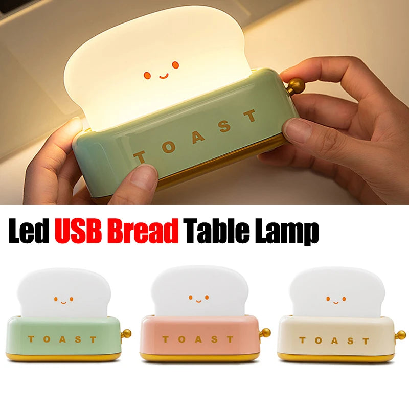 LED USB bread table lamp with a hand holding it, showing its glowing face.