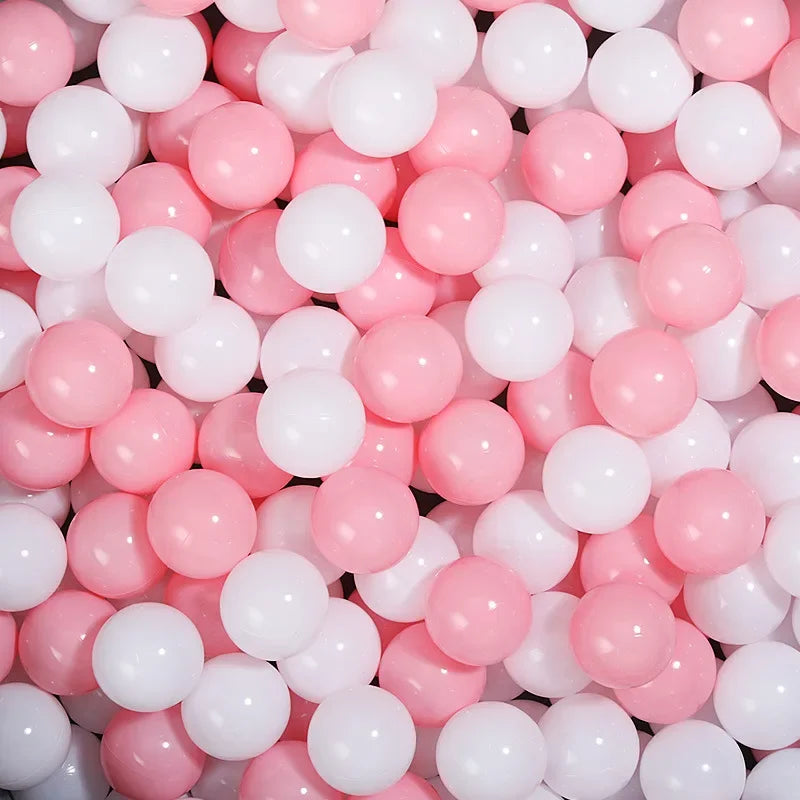 Close-up of pink and white balls fo tent ball pitt
