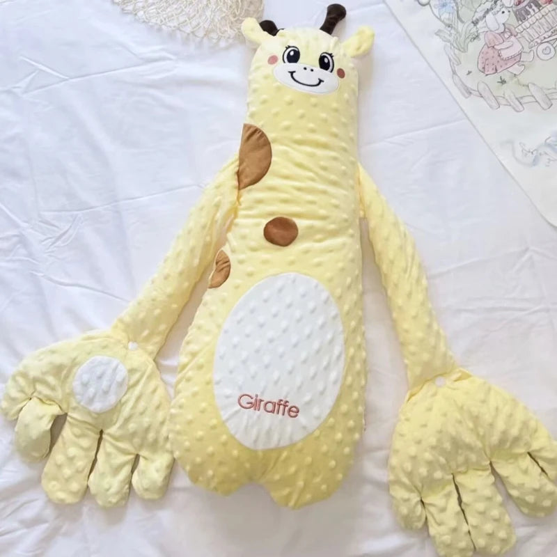 Yellow giraffe plush toy on a white surface