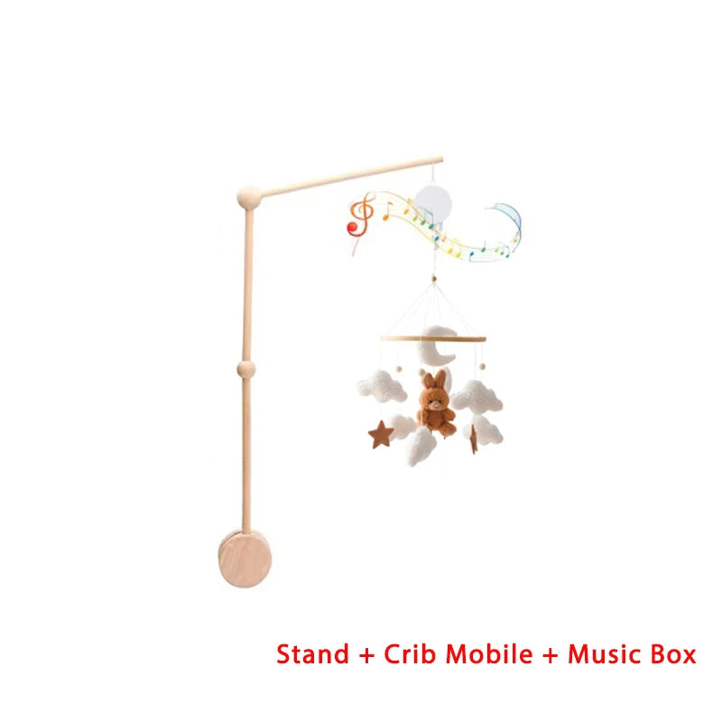 Baby crib mobile with toys and music box on a white background