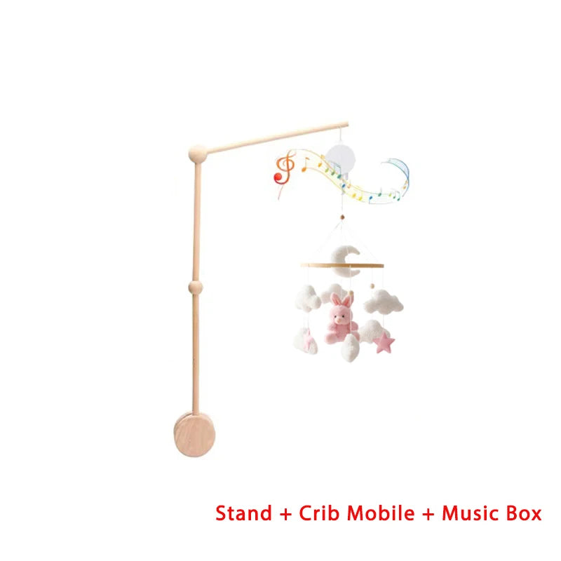 Baby crib mobile with stand and music box on a white background